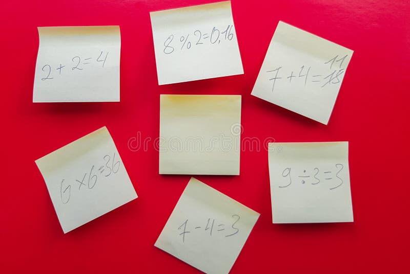 Blank yellow sticky notes with mathematical equations and solving them on a red background, concept of business and study work. royalty free stock photography Blank yellow sticky notes with mathematical equations and solving them on a red background, concept of business and study work. royalty free stock photography