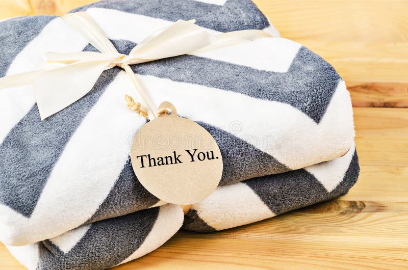 blanket-thank-you-tag-gift-ribbon-wooden-background-concept-82741686.jpg