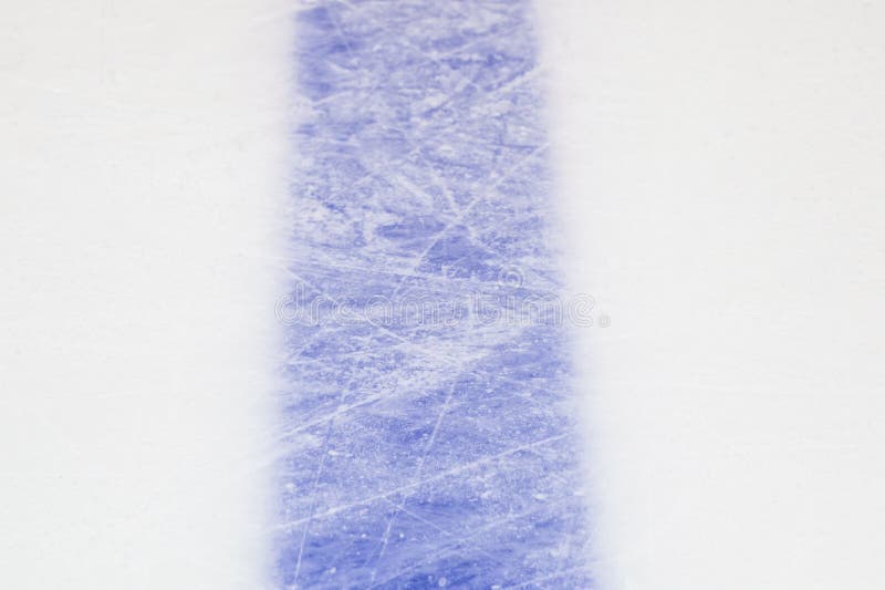 Ice hockey rink blue markings closeup, winter sport background. Ice hockey rink blue markings closeup, winter sport background.