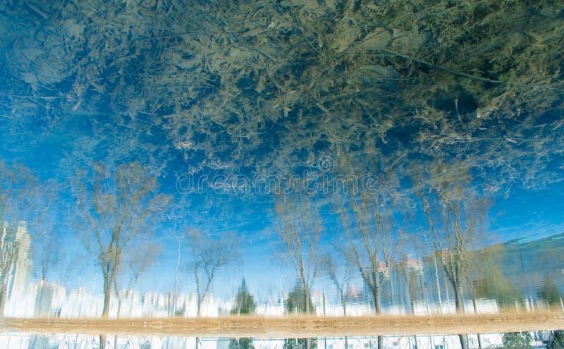 The natural scenery blue reflection in the water by a photograph turned upside. The natural scenery blue reflection in the water by a photograph turned upside