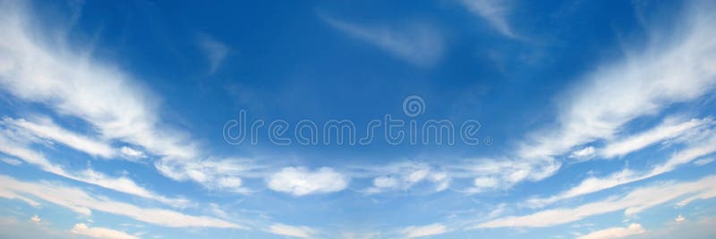 White fluffy clouds on a blue sky background. Wide screen. White fluffy clouds on a blue sky background. Wide screen