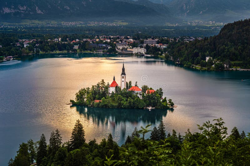 Bled, Slovenia - Pilgrimage Church of the Assumption of Maria on an island at Lake Bled Blejsko Jezero and Julian Alps