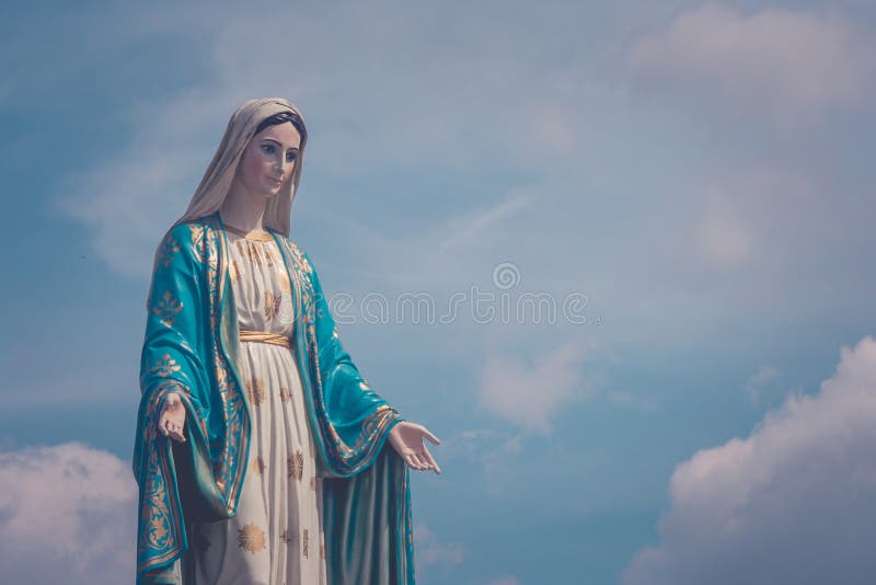 The Blessed Virgin Mary statue standing in front of The Cathedral of the Immaculate Conception at The Roman Catholic Diocese.