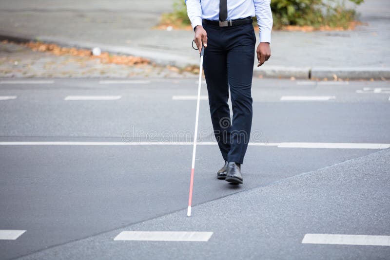 Blind Person Walking On Street