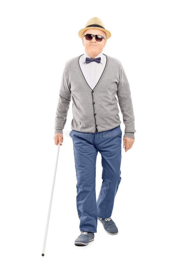 Blind senior gentleman walking with a stick