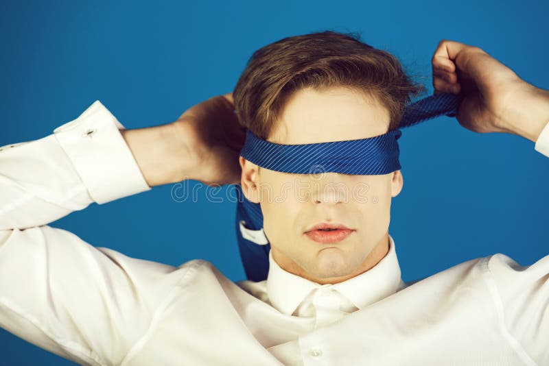 Blind Way of Life. Blindfolded Man with Tie on Eyes in White Shirt