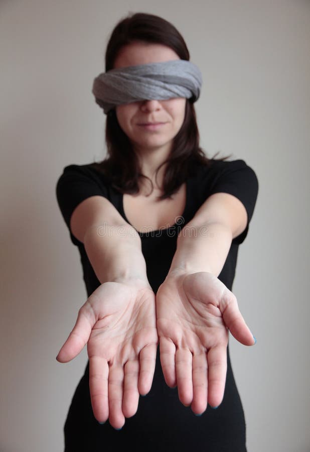 Blindfolded woman stretching arms forward royalty free stock photos Blindfolded woman stretching arms forward royalty free stock photos