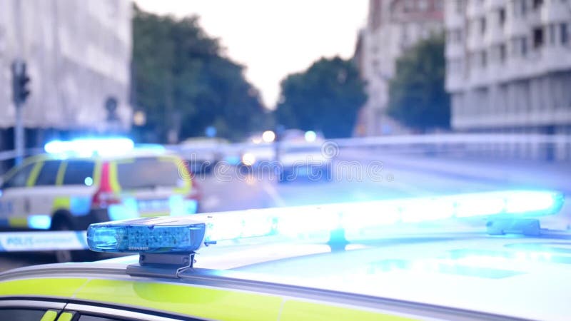 Blinkande blåa ljus för polisbil