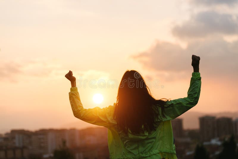 Blissful woman celebrating sport and fitness lifestyle success