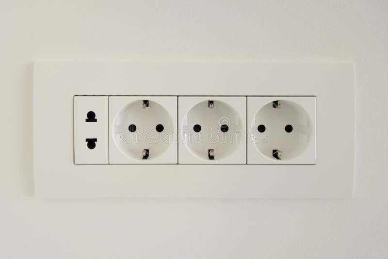 A Block of White Outlets Consisting of Three EU Standard Outlets with