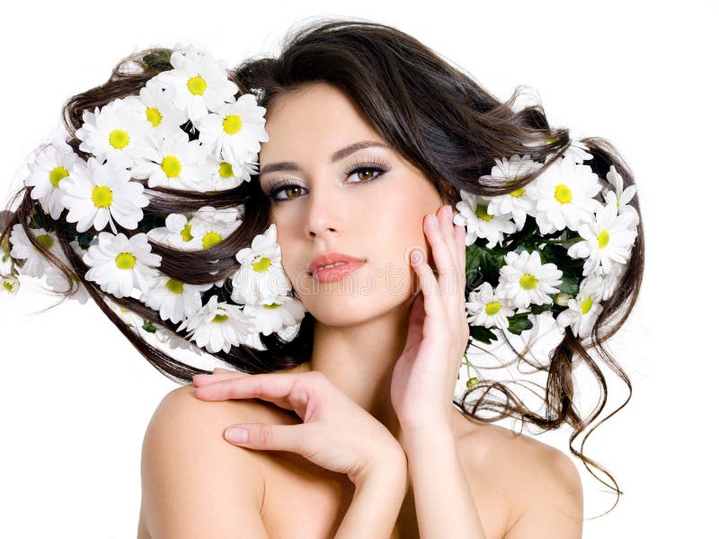 Beautiful woman with flowers in her long hair - white background. Beautiful woman with flowers in her long hair - white background