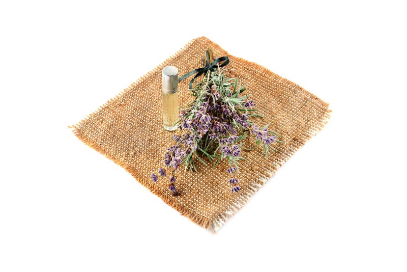 Blommor och lavendelolja som isoleras på vit bakgrund royaltyfri bild Blommor och lavendelolja som isoleras på vit bakgrund royaltyfri bild