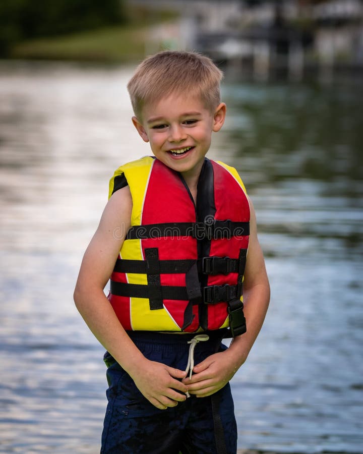 Blond Boy Wearing a Life Jacket Stock Photo Image of person, child
