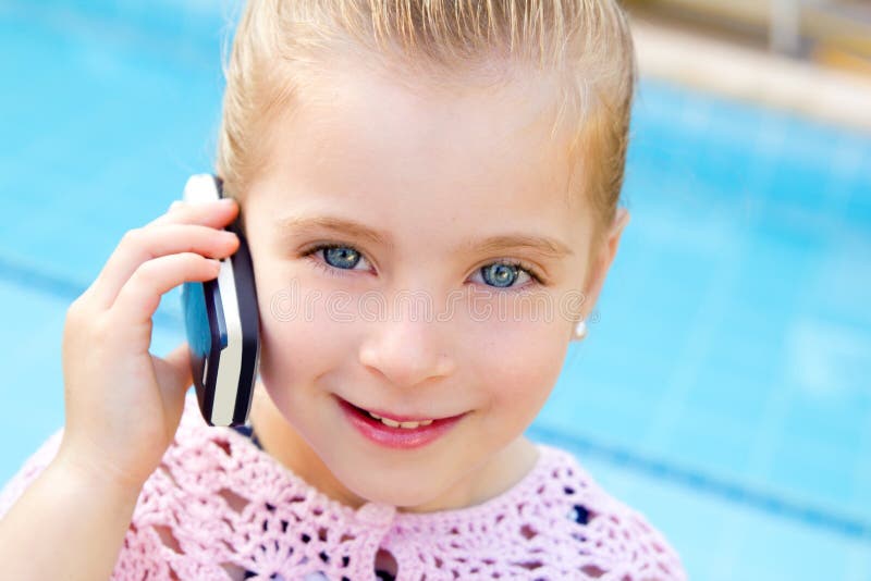 Blond child little girl talking mobile phone