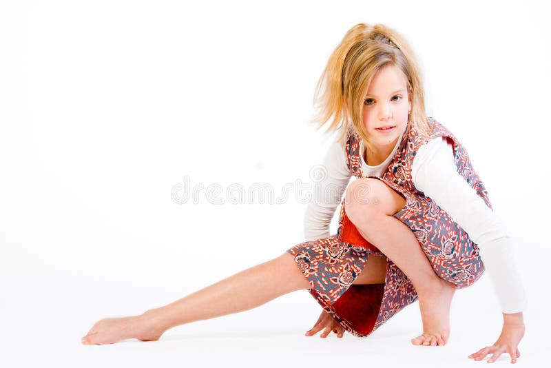 Blond child stretching her leg