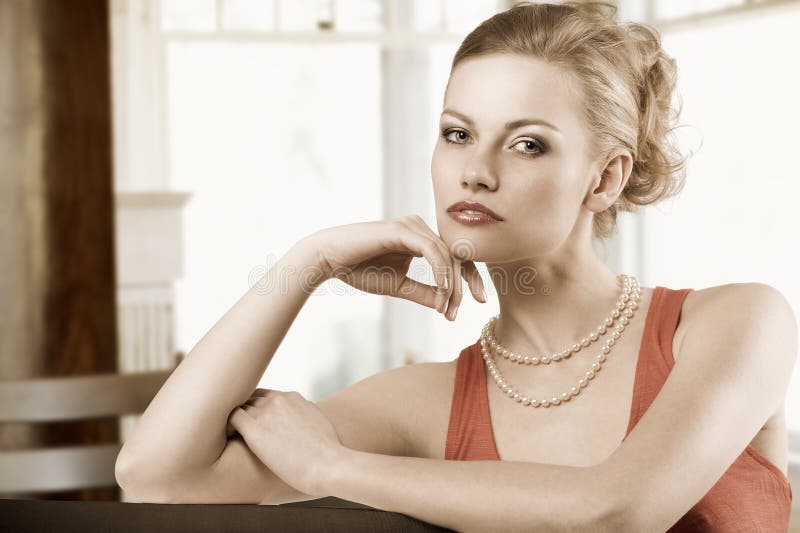 Blond elegant woman in red