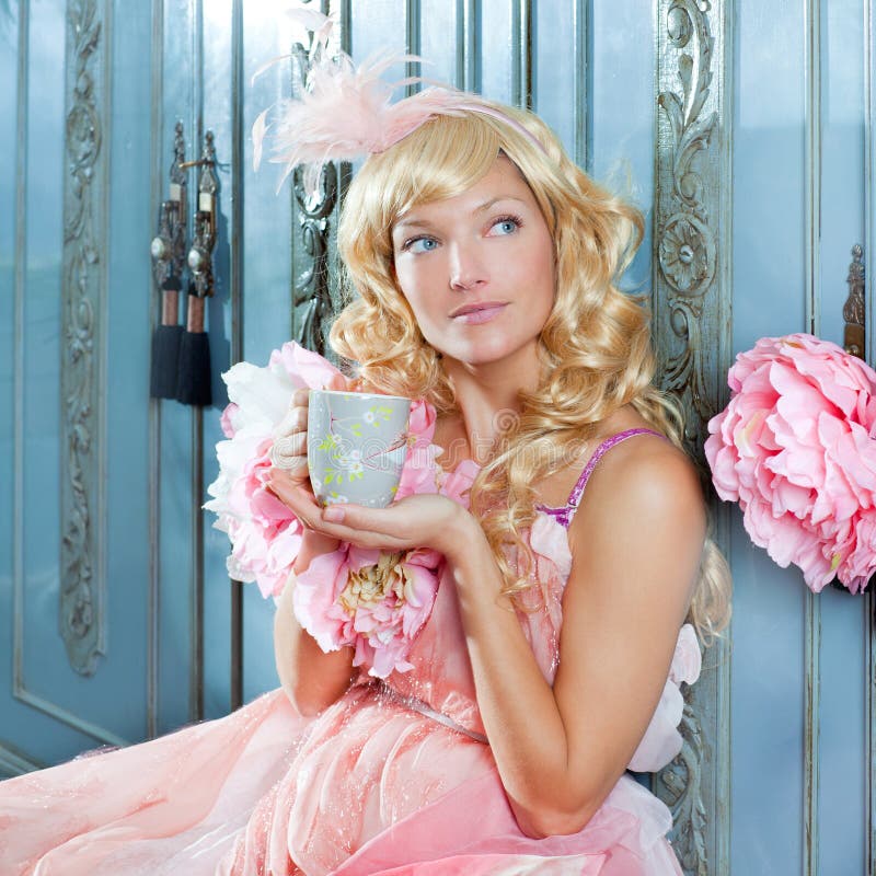 Blond fashion princess woman drinking tea