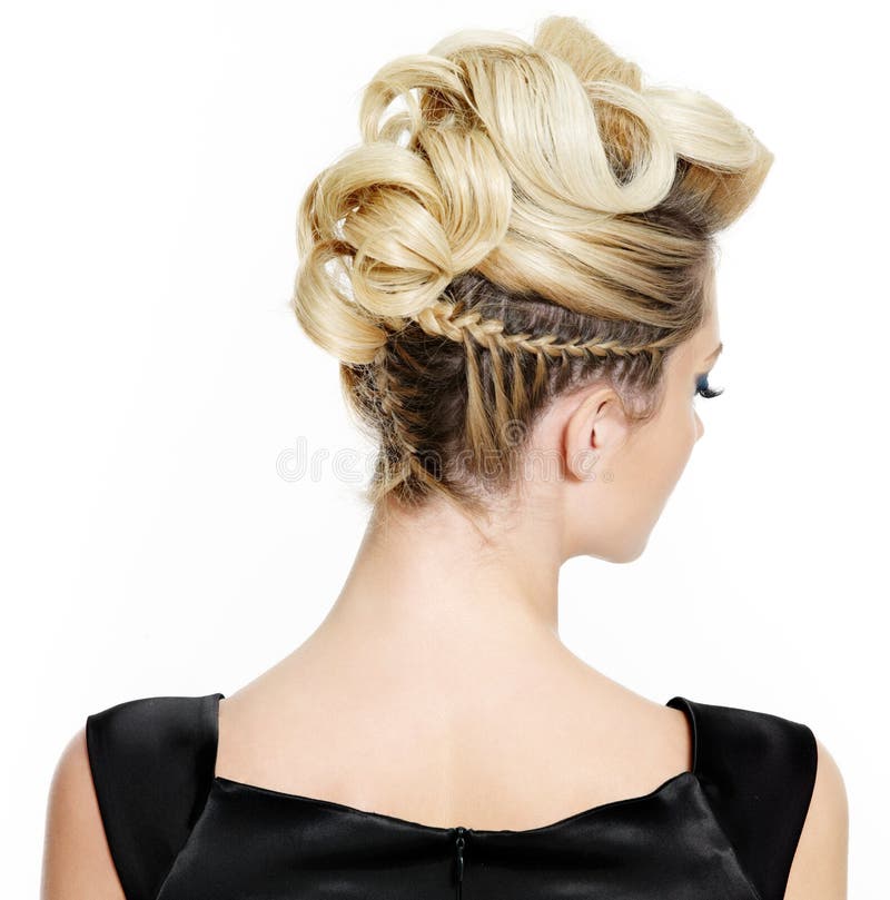 Blond female with creative curly hairstyle, rear view on white background