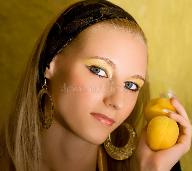 Blond girl with apricot