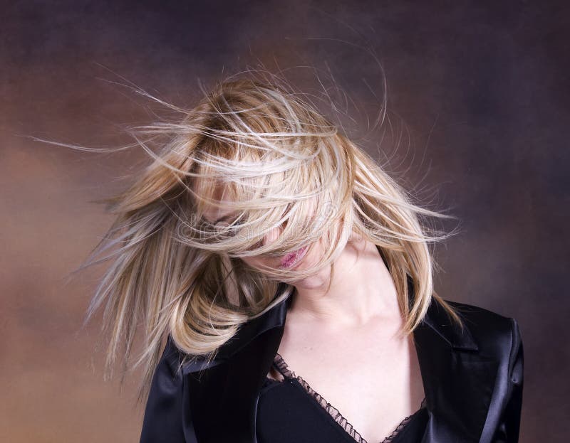 Blond girl fluttering hair