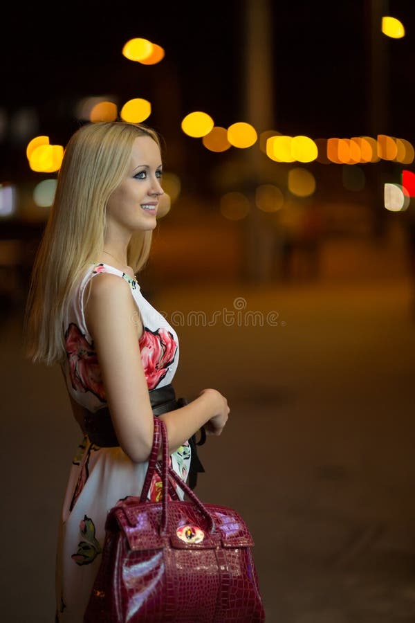 Blond girl at night city