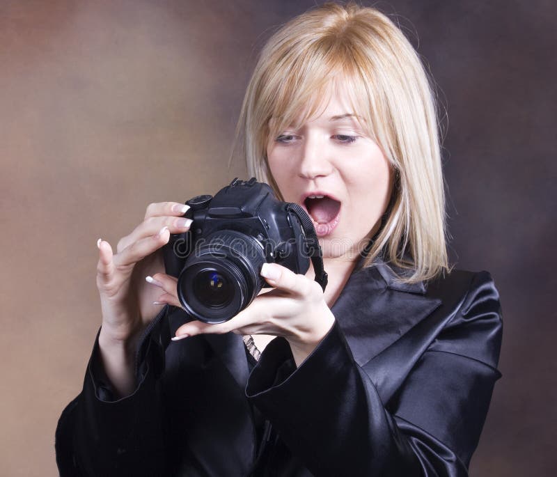 Blond girl with photo camera