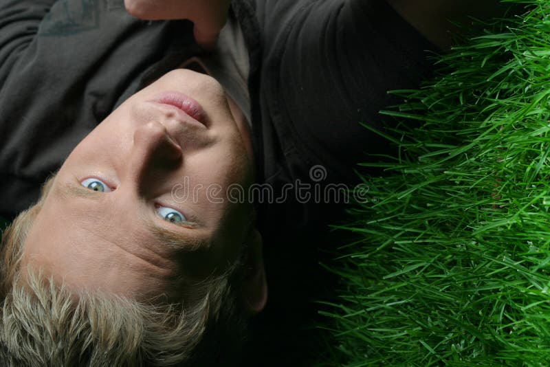 Blond guy on grass