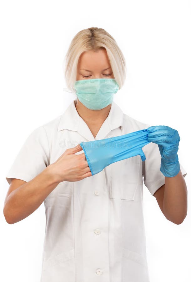 Blond nurse wearing gloves stock image. Image of mask 12112337
