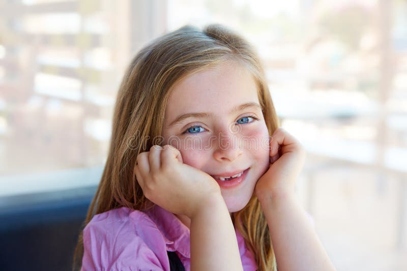 Blond relaxed happy kid girl expression blue eyes stock photos Blond relaxed happy kid girl expression blue eyes stock photos