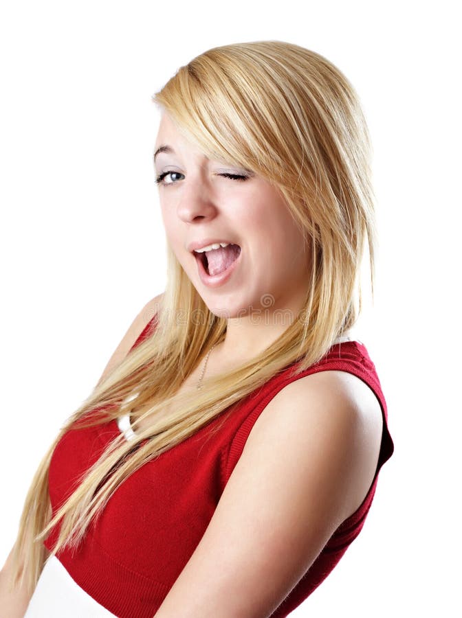 Free Photo  Young sporty woman winking and smiling showing two fingers  standing over purple wall