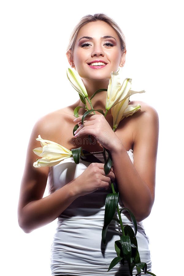 Blond woman with fresh clean skin and white lily flower isolated royalty free stock images Blond woman with fresh clean skin and white lily flower isolated royalty free stock images