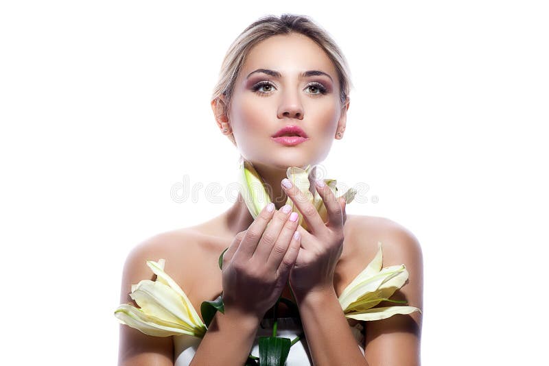 Blond woman with fresh clean skin and white lily flower isolated stock photo Blond woman with fresh clean skin and white lily flower isolated stock photo