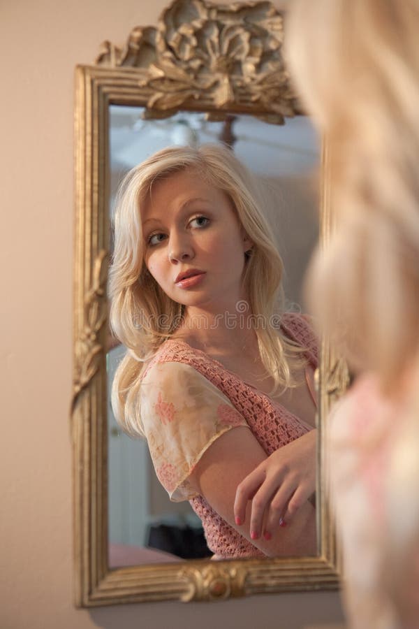 Blond Woman Gazing at Self in Mirror