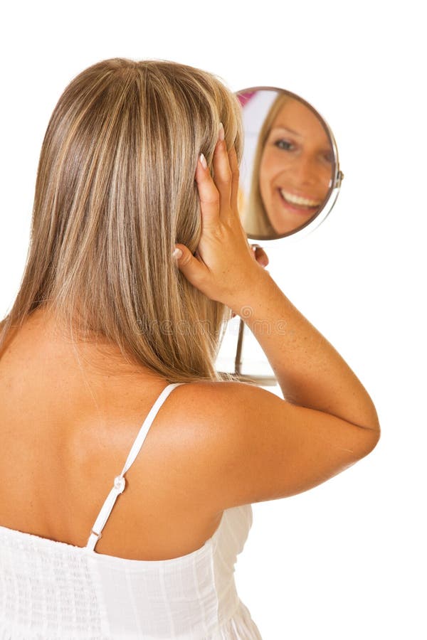 Blond woman with mirror isolated