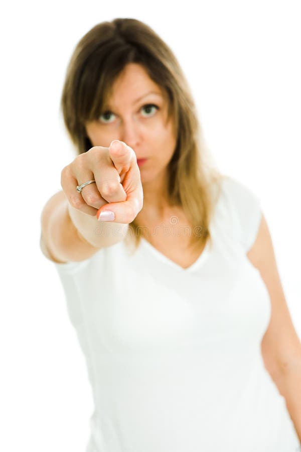 Blond woman points with finger at camera - I see you royalty free stock photo
