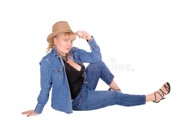 Blond woman sitting on floor.