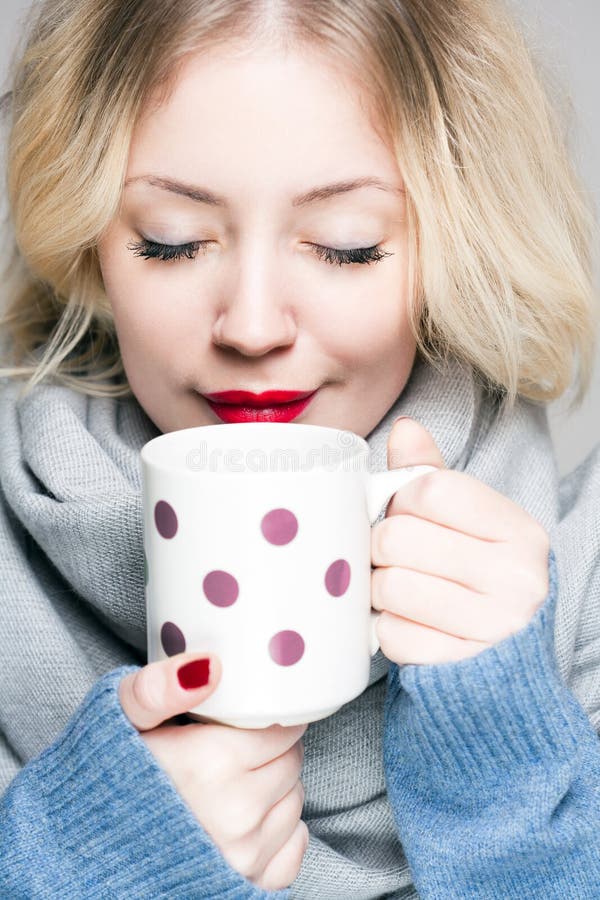 Blond woman in warm clothes.