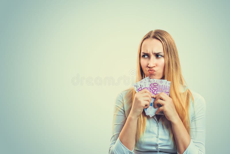 Greedy woman with pile of money stock image Greedy woman with pile of money stock image