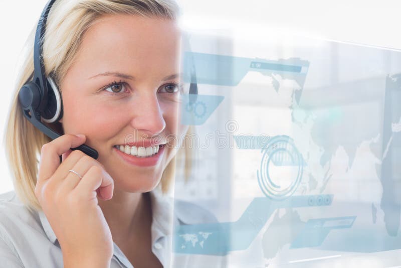 Blonde call center worker using futuristic holographic interface stock image Blonde call center worker using futuristic holographic interface stock image