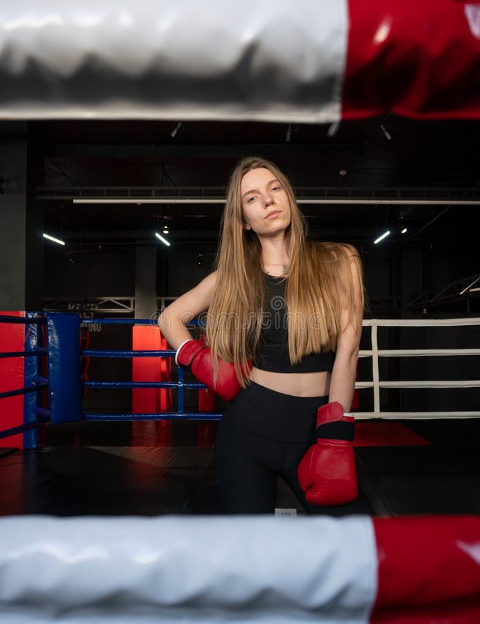Blonde Caucasian Fighter Girl in Red Boxing Gloves is Posing on Fight ...