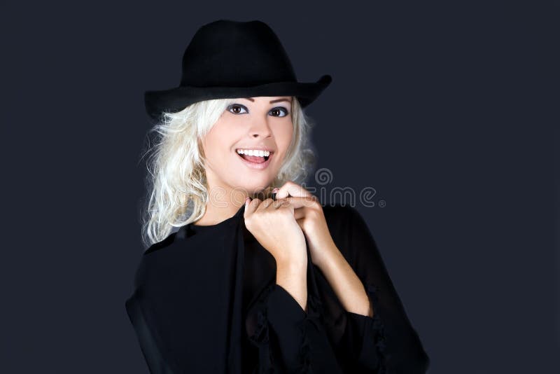 Blonde fashion woman portrait wearing black hat