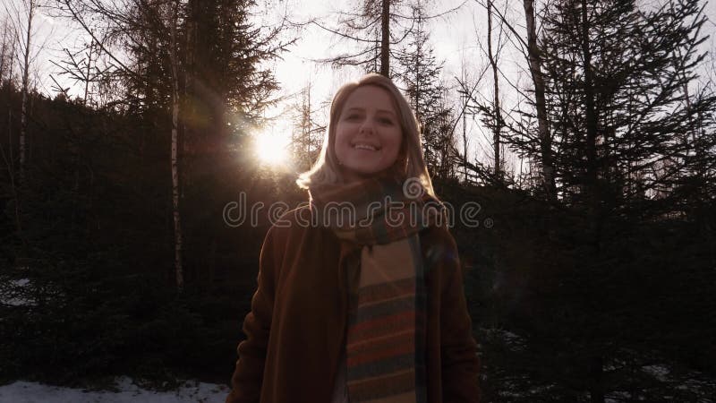 Blonde in the forest during sunset