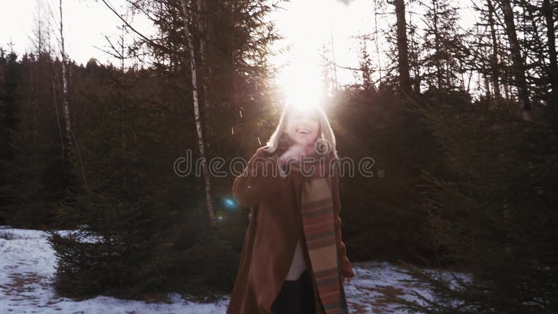 Blonde in the forest during sunset