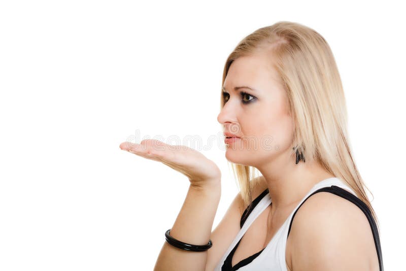 Blonde Girl Blowing A Kiss Or With Copy Space On Hand Stock Image
