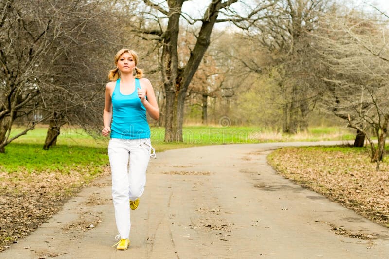 Blonde girl jogging