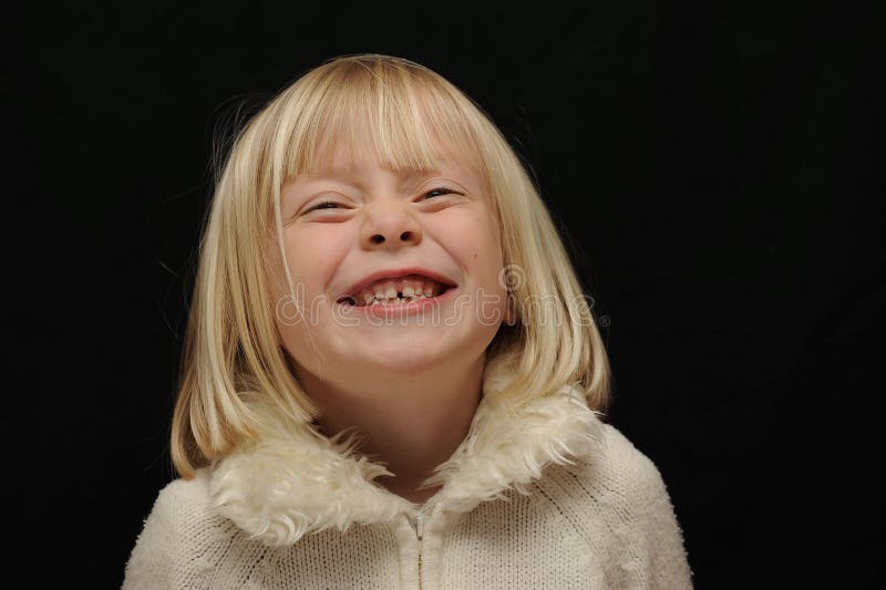 Young Caucasian Girl Smiling and showing her teeth. Young Caucasian Girl Smiling and showing her teeth