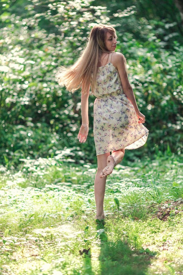 Blonde Girl in a Light Airy Dress, Barefoot at Dawn in a Summer Forest ...