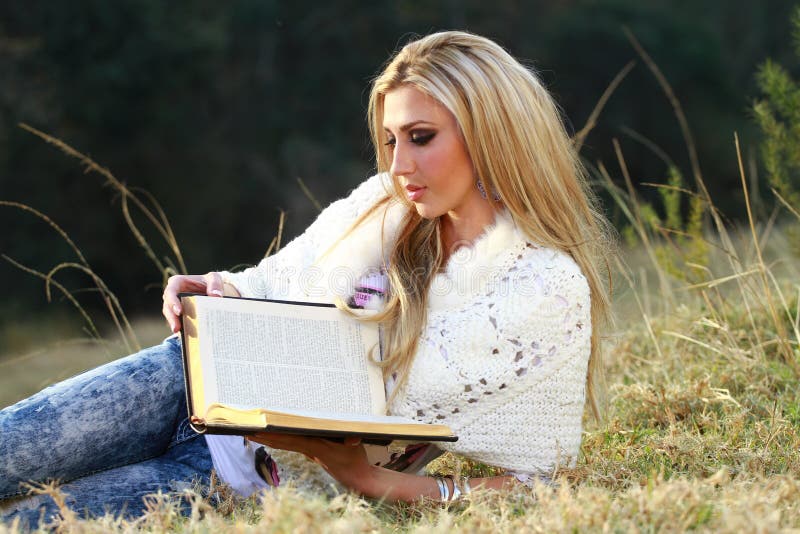 Blonde lady reading Bible