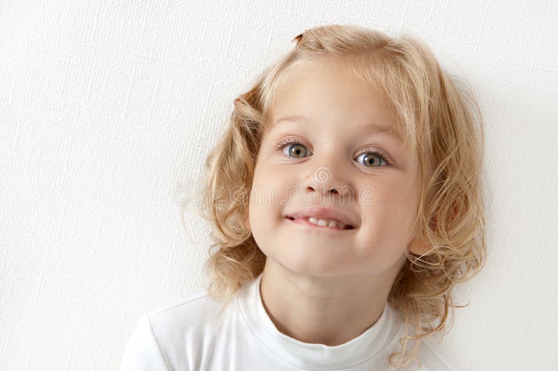 Blonde little girl dressed in white stock photography Blonde little girl dressed in white stock photography