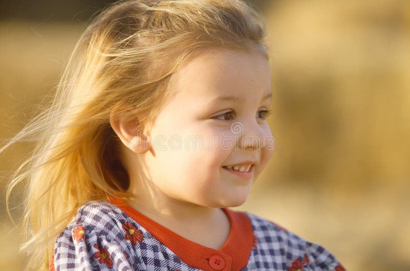 Blonde Little Girl In a Field